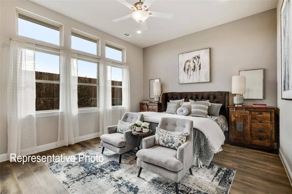 1415 Odette Drive, Arlington, TX 76013 The property features tall windows with transoms, providing ample natural light