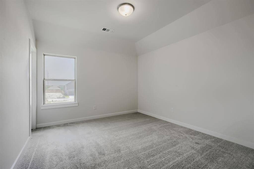 828 Stone Grove Road, Lavon, TX 75166 Room featuring light gray carpet flooring, white painted walls, and a single window with white trim