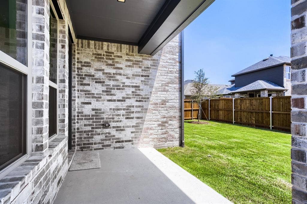 828 Stone Grove Road, Lavon, TX 75166 Covered patio with concrete flooring