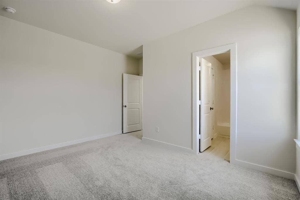 828 Stone Grove Road, Lavon, TX 75166 Neutral carpet flooring and light-toned walls