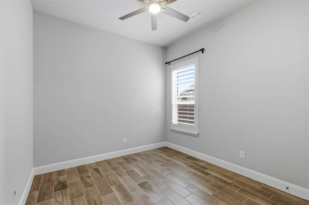 11414 Alejandra Lane, Frisco, TX 75035 First Floor Secondary Bedrooms: Neutral paint tones complemented by wood-finish flooring