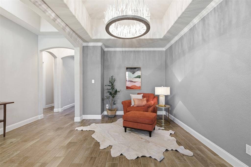11414 Alejandra Lane, Frisco, TX 75035 Tray ceiling featuring a unique chandelier in the formal dining room