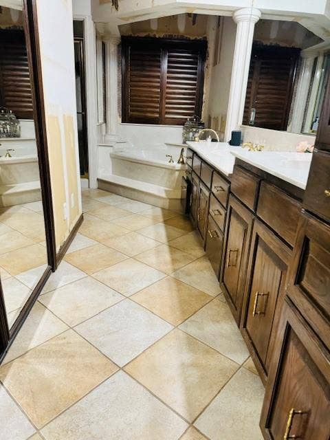 Full bath with a bath and double vanity