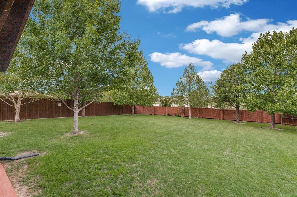 Brick fence at the rear of the property is maintained by the HOA.