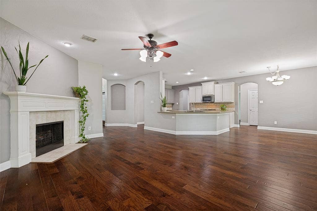 Living area, kitchen, and dining area are all open to one another.