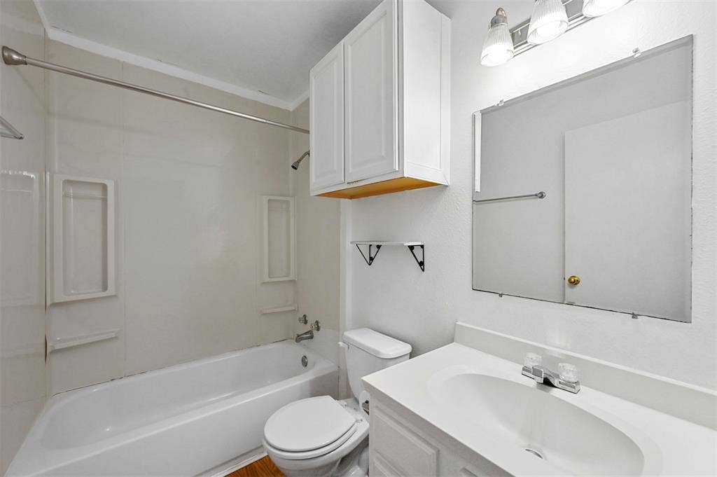214 Wildflower Drive, Gun Barrel City, TX 75156 Full bathroom with shower / bathtub combination, vanity, and toilet