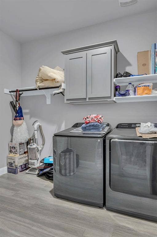 1000 Westwood Lane, Argyle, TX 76226 This utility space features durable flooring, wall-mounted shelving, and cabinetry for storage