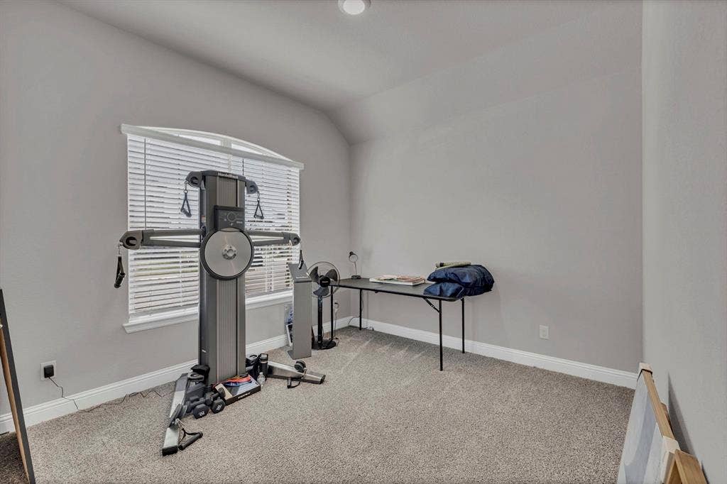 1000 Westwood Lane, Argyle, TX 76226 This versatile room features carpeted flooring, light grey walls, and a window with blinds