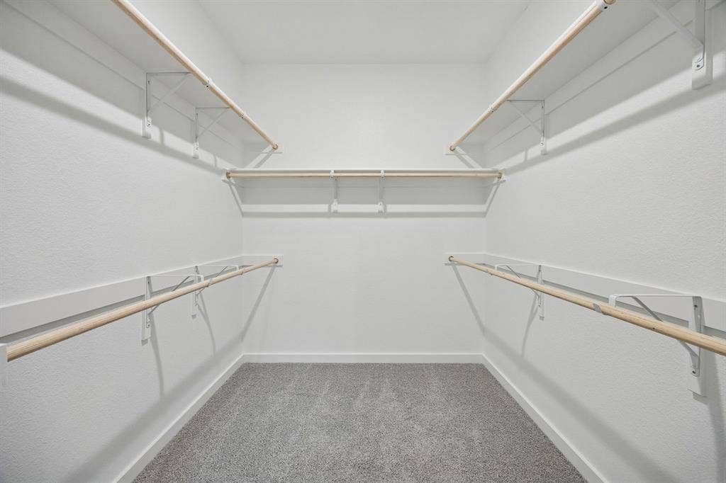489 Hocking Hills Drive, Waxahachie, TX 75165 Primary Closet in the Masters home plan by Trophy Signature Homes – REPRESENTATIVE PHOTO