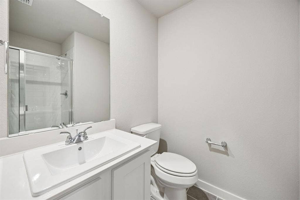 Bathroom in the Hayden home plan by Trophy Signature Homes – REPRESENTATIVE PHOTO