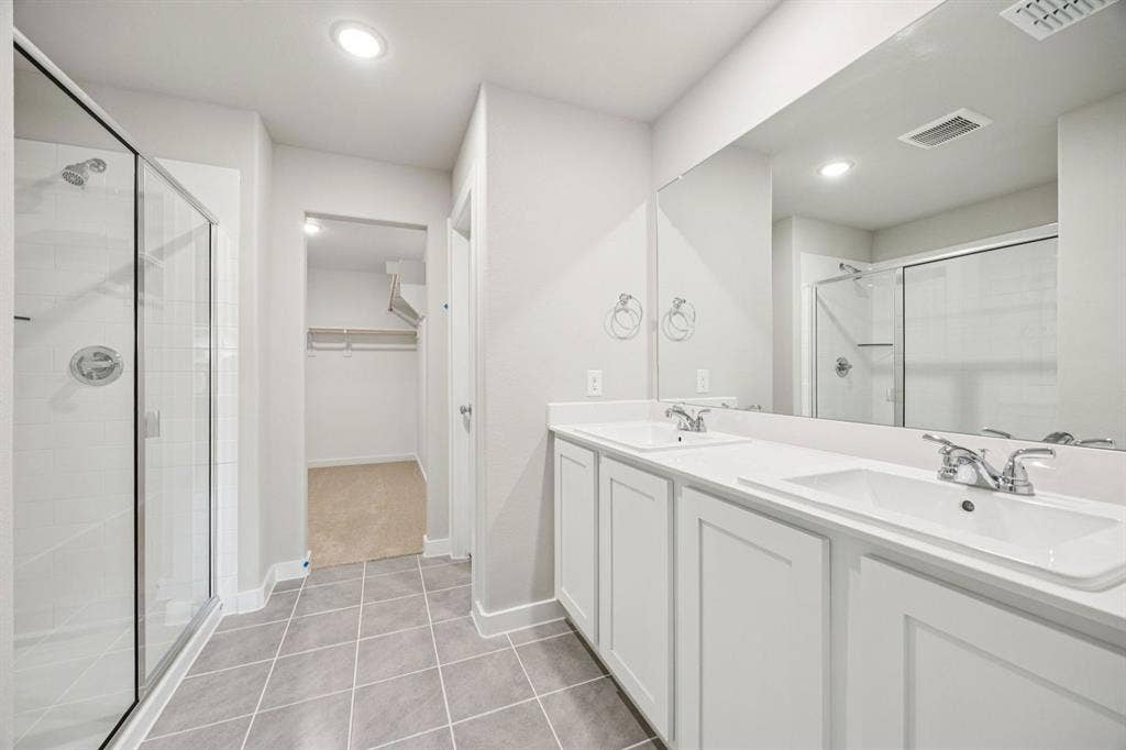 Primary Bathroom in the Hayden home plan by Trophy Signature Homes – REPRESENTATIVE PHOTO
