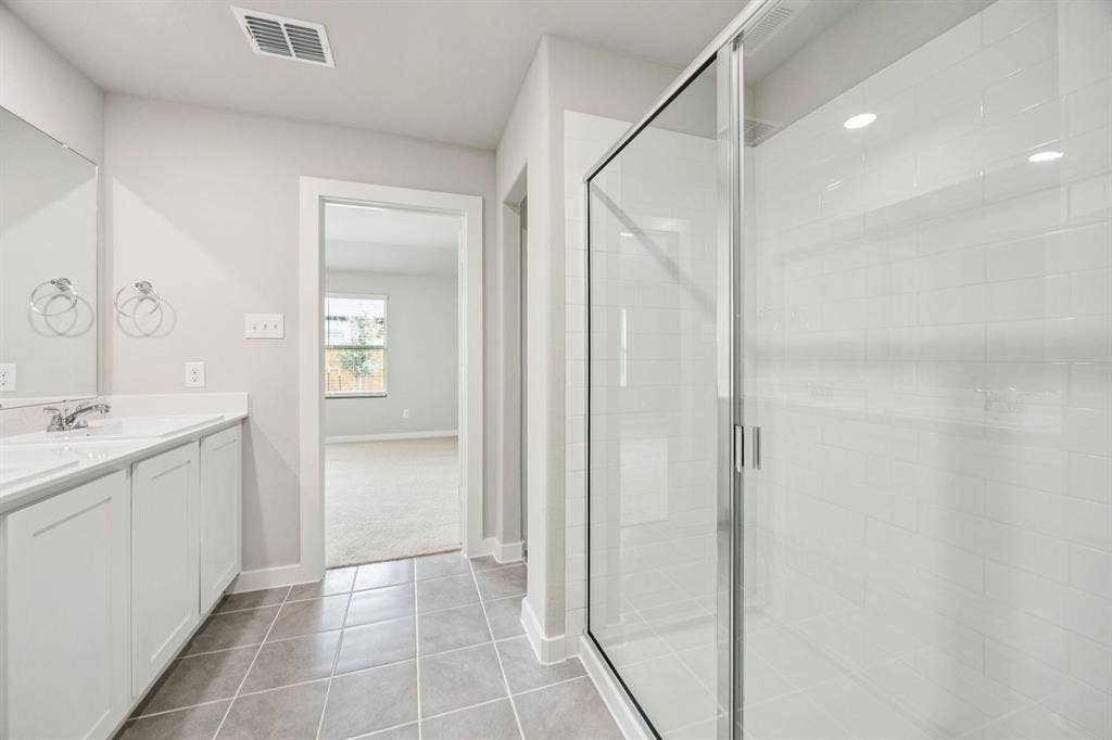 Primary Bathroom in the Hayden home plan by Trophy Signature Homes – REPRESENTATIVE PHOTO