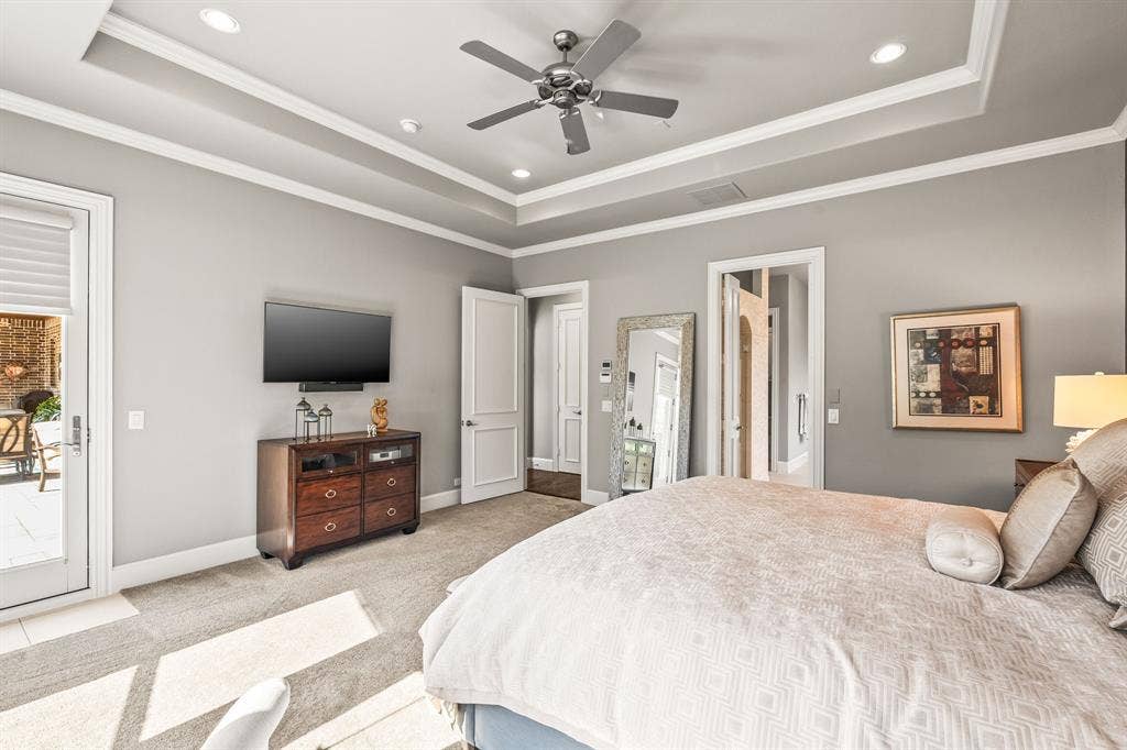 1640 Stillhouse Hollow Drive, Prosper, TX 75078 View of the primary bedroom showing the door to the open patio and lots of wall space.