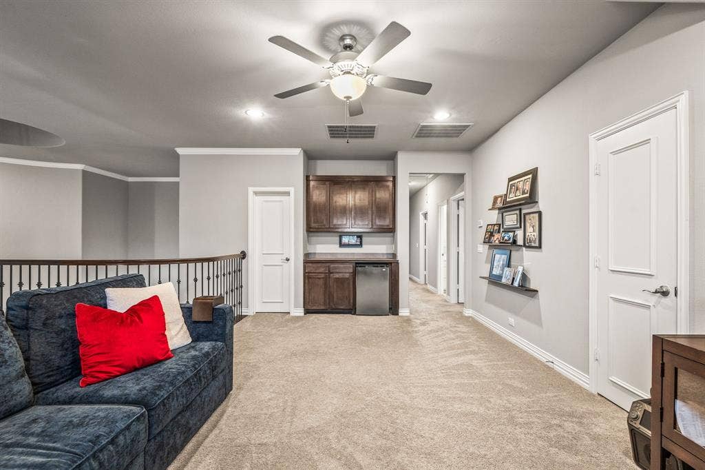 1640 Stillhouse Hollow Drive, Prosper, TX 75078 The game room has a built-in dry bar, cabinet storage and refrigerator.