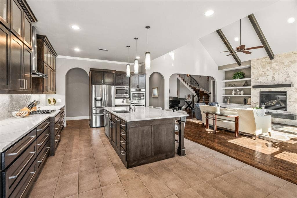 1640 Stillhouse Hollow Drive, Prosper, TX 75078 View of kitchen looking towards the living area and front entry.