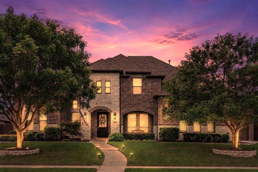 1640 Stillhouse Hollow Drive, Prosper, TX 75078 Sunset view of the front on the home - enjoy all the incredible features this home offers.