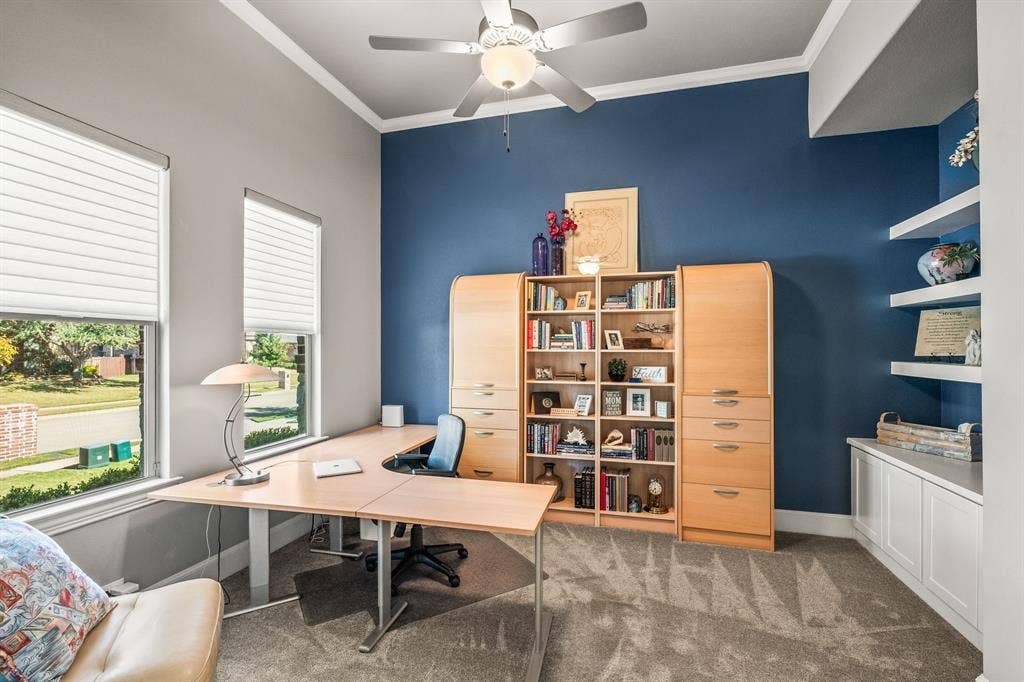 1640 Stillhouse Hollow Drive, Prosper, TX 75078 The office is located at the front on the home with a hallway from the front door. It has built-in shelves and cabinet for storing office supplies.