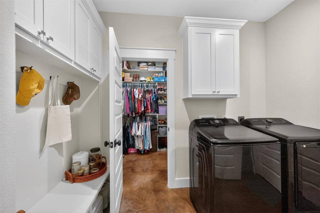 6371 Mill Run Road, Athens, TX 75751 Dedicated utility area featuring white shaker-style cabinetry, a built-in bench with storage, and a deep walk-in closet with custom shelving