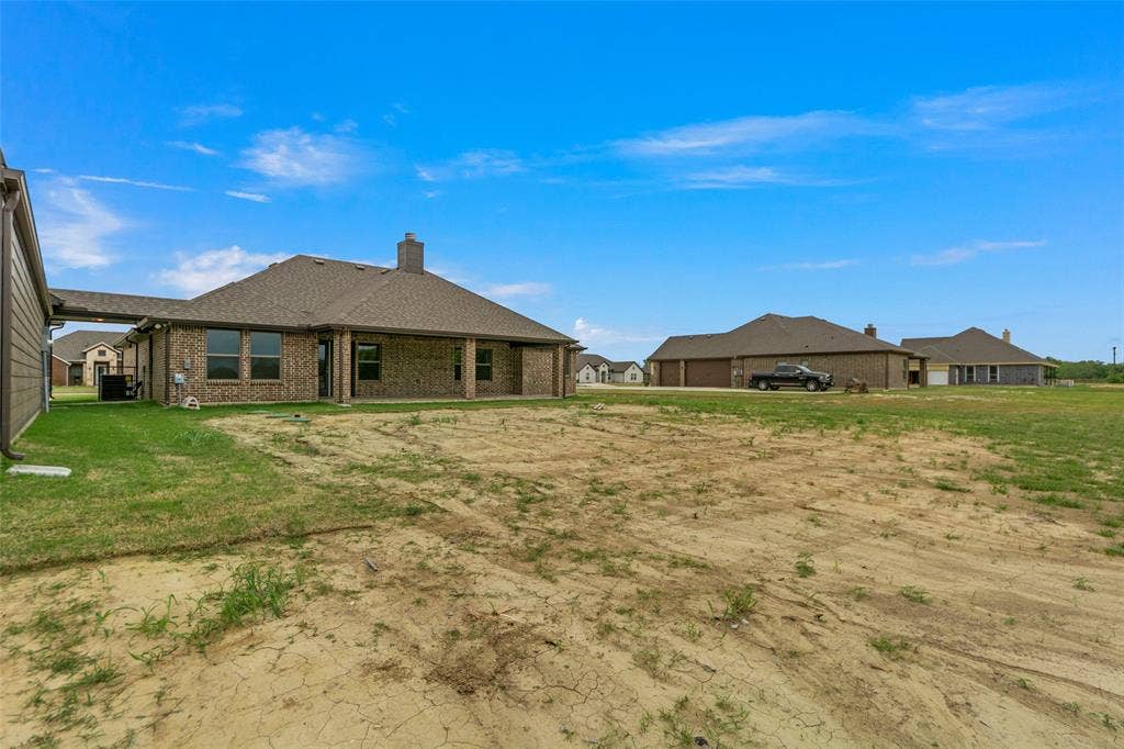 18310 CHIPPEWA Court, Terrell, TX 75160 Expansive outdoor space featuring a partial green lawn and open ground