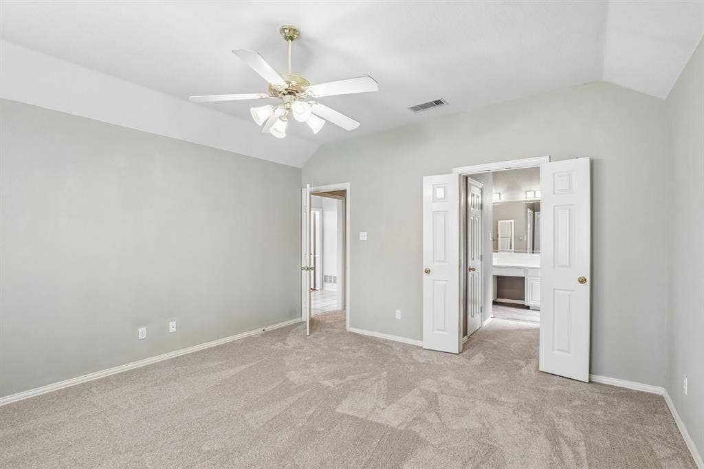 4124 Cory Lee Court, Arlington, TX 76015 Spacious room featuring vaulted ceilings, light gray walls, and plush carpeting