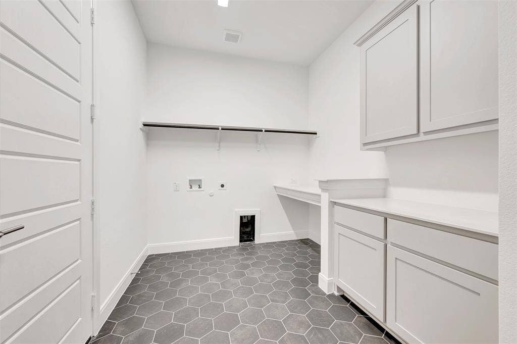 1611 Cedarberry Drive, Northlake, TX 76226 Hexagonal tile flooring, white cabinetry, built-in countertop space, and a wall-mounted shelving unit