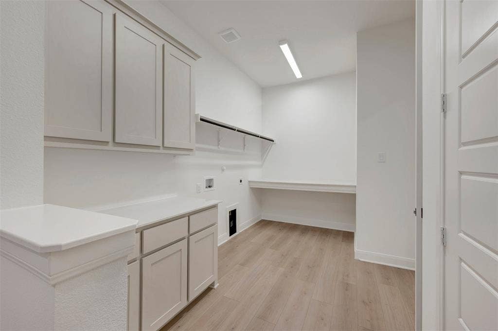 1605 Cedarberry Drive, Northlake, TX 76226 White shaker-style cabinetry with integrated countertops