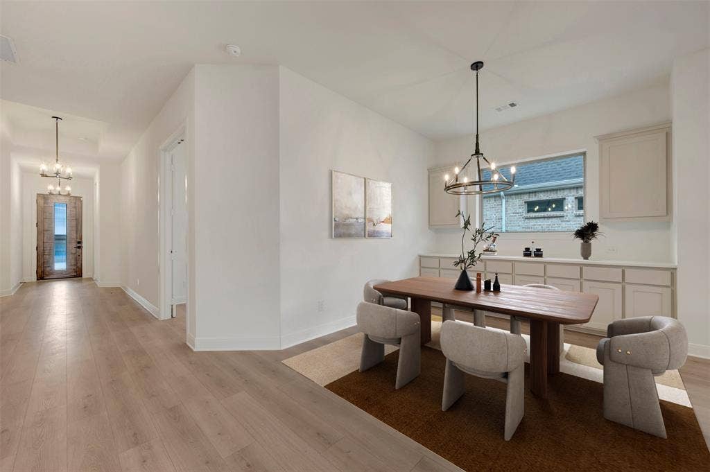 1605 Cedarberry Drive, Northlake, TX 76226 Wood-finish flooring throughout, recessed lighting, built-in cabinetry with integrated window, and a decorative chandelier