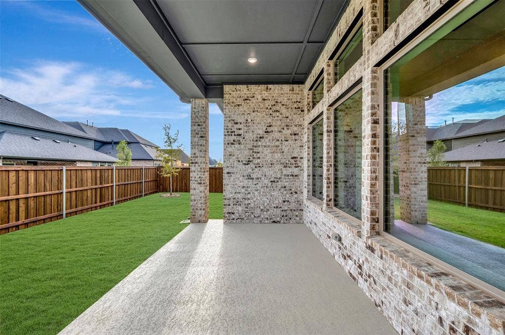 1605 Cedarberry Drive, Northlake, TX 76226 Covered patio with a concrete surface, extensive brick exterior, and large pane windows