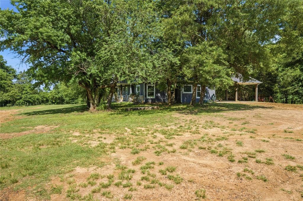 7600 County Road 1500, Athens, TX 75751 Side view with carport area