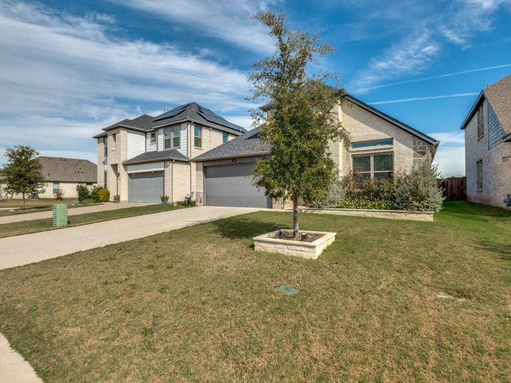 626 Congressional Avenue, Red Oak, TX 75154 Stone and siding exterior with a two-car garage
