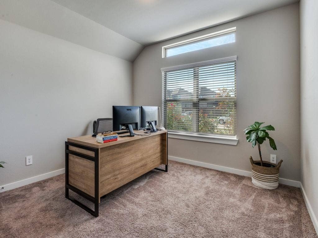 626 Congressional Avenue, Red Oak, TX 75154 Light-filled interior space featuring a large window with blinds and an additional transom window