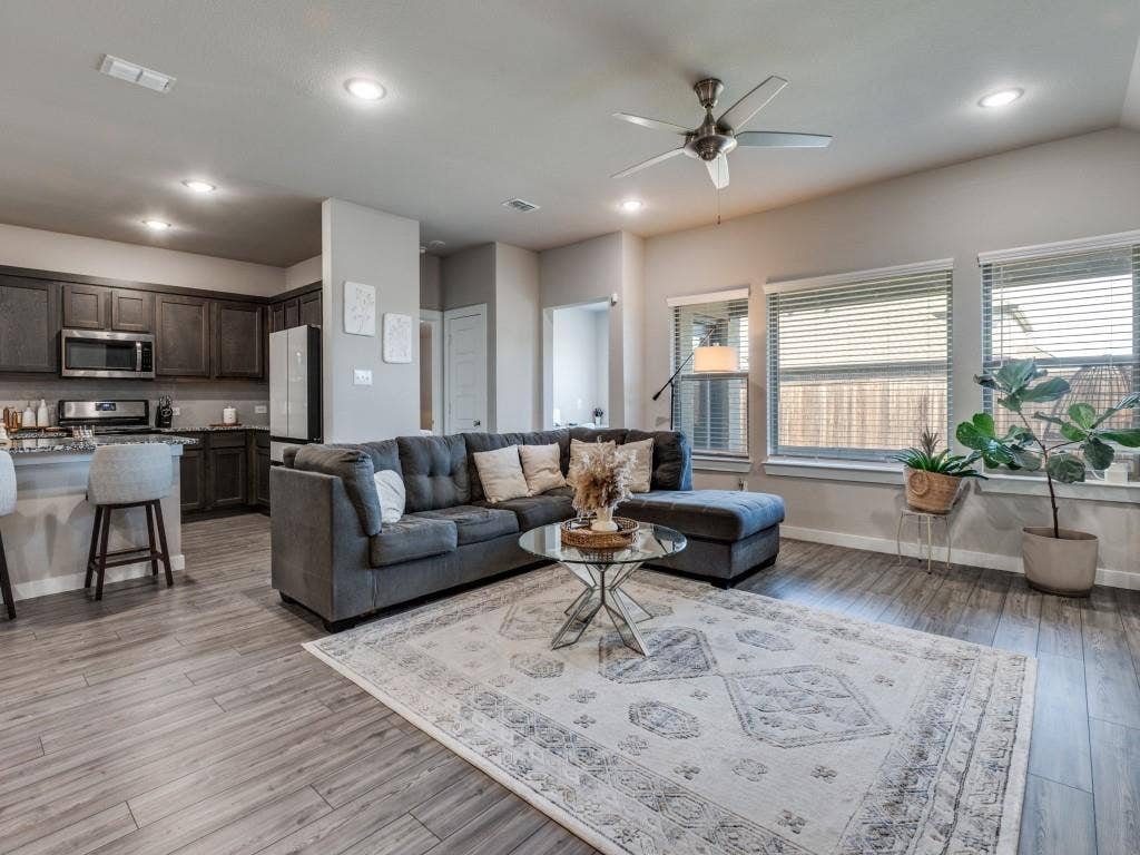 626 Congressional Avenue, Red Oak, TX 75154 Wood-finish flooring extending throughout the open concept living area and kitchen