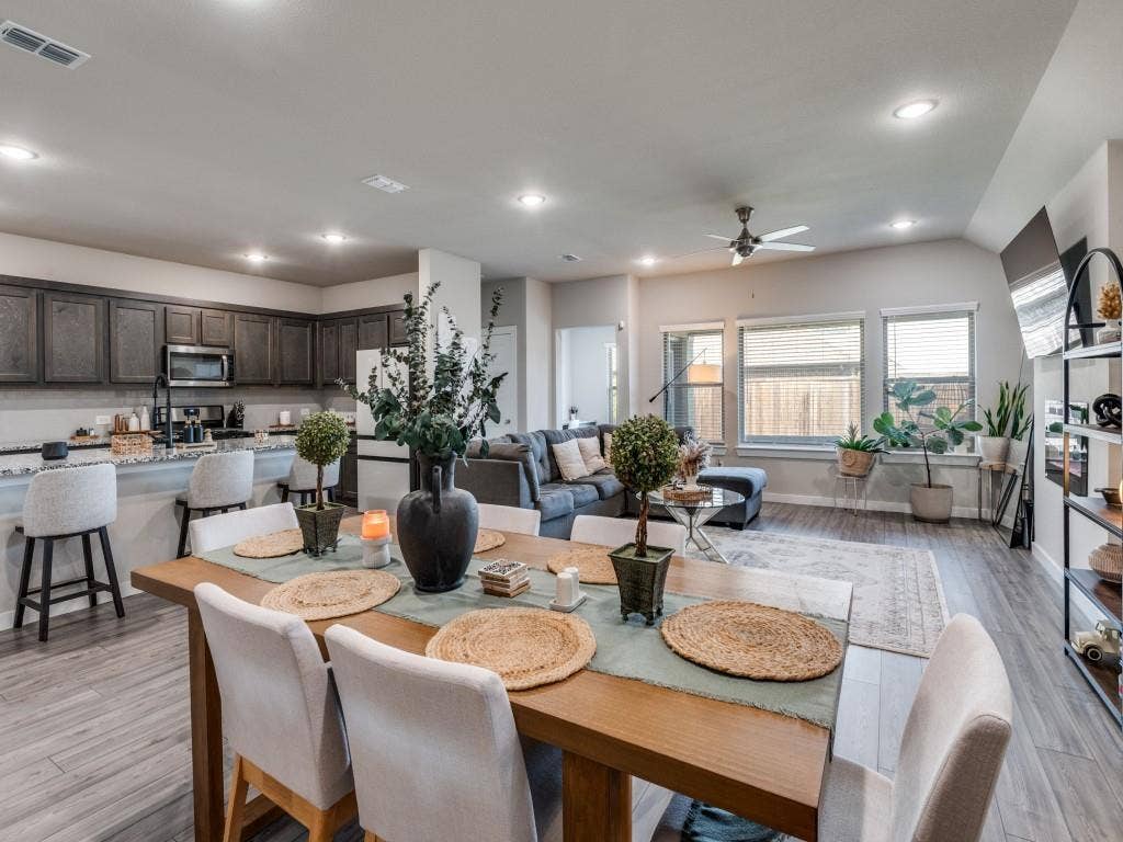 626 Congressional Avenue, Red Oak, TX 75154 Open-concept living space featuring wood-finish flooring throughout