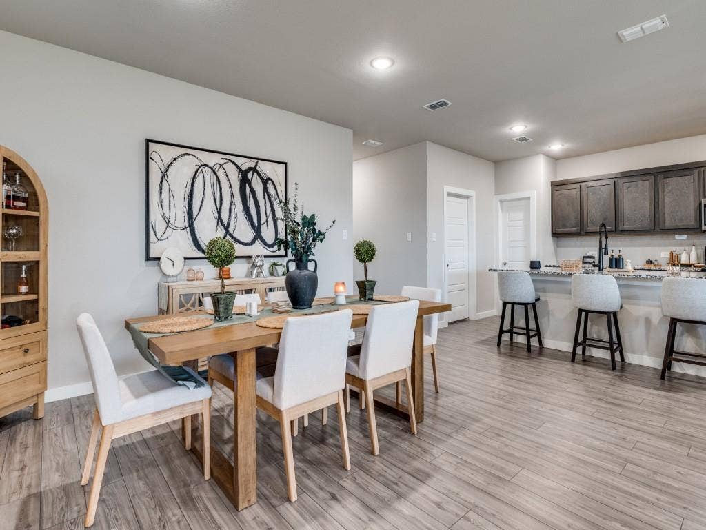 626 Congressional Avenue, Red Oak, TX 75154 Open-concept dining area featuring wood-finish flooring, a light gray wall color, and recessed lighting
