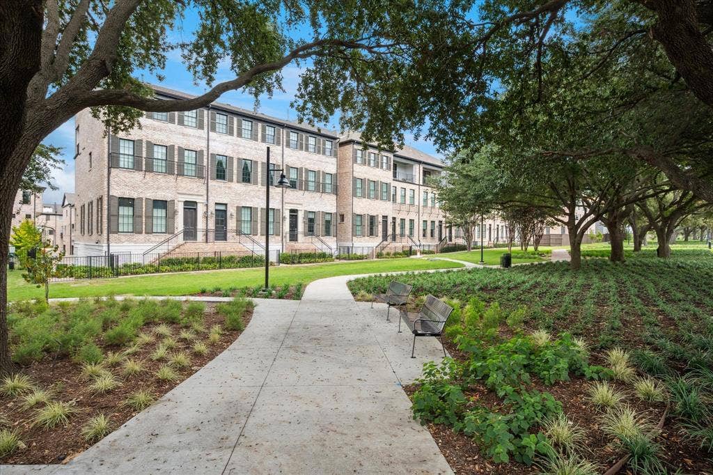 14956 Oak Street, Addison, TX 75001 Townhome architecture featuring light-colored brick facades and dark window shutters