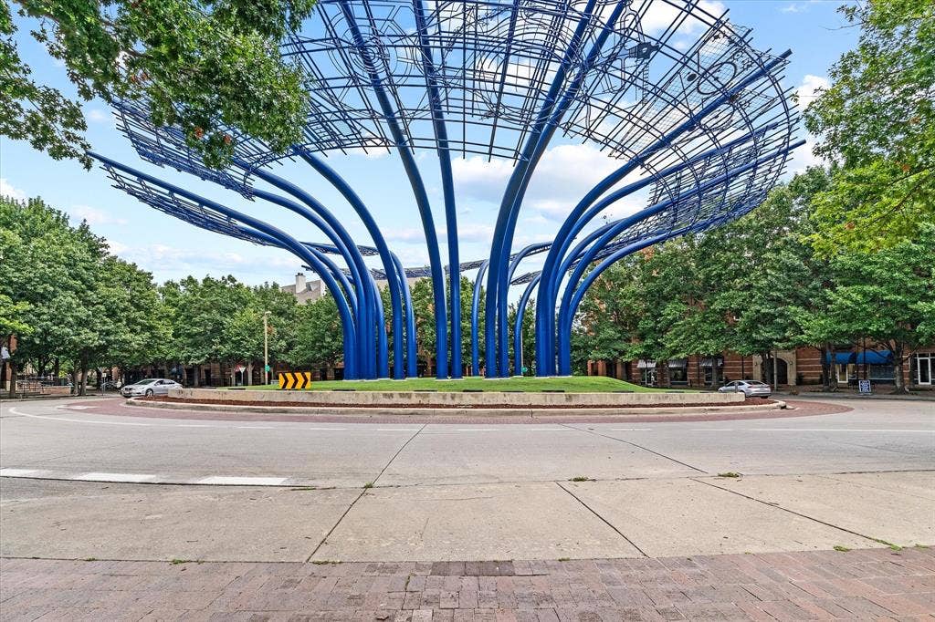 14956 Oak Street, Addison, TX 75001 Central roundabout featuring a prominent blue sculptural installation