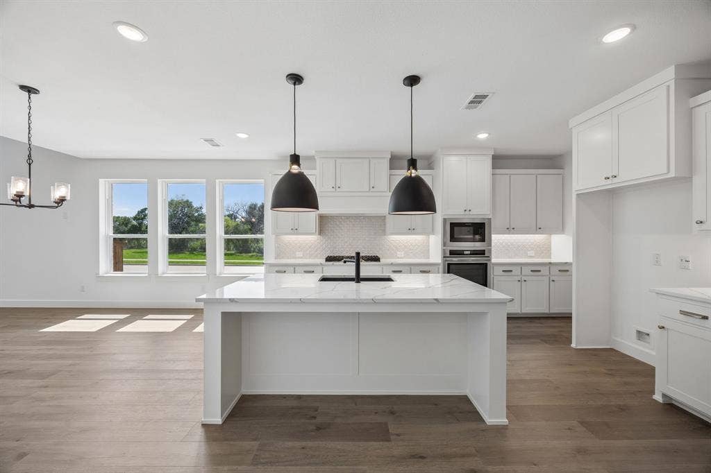4211 Rosita Lane, Prosper, TX 75078 The chef in the family will never be left out of the party in this over the top kitchen!