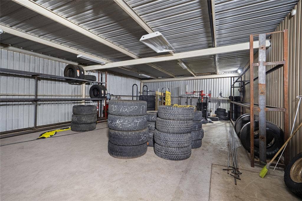 807 W Corsicana Street, Athens, TX 75751 Spacious commercial-style interior featuring a corrugated metal ceiling and walls