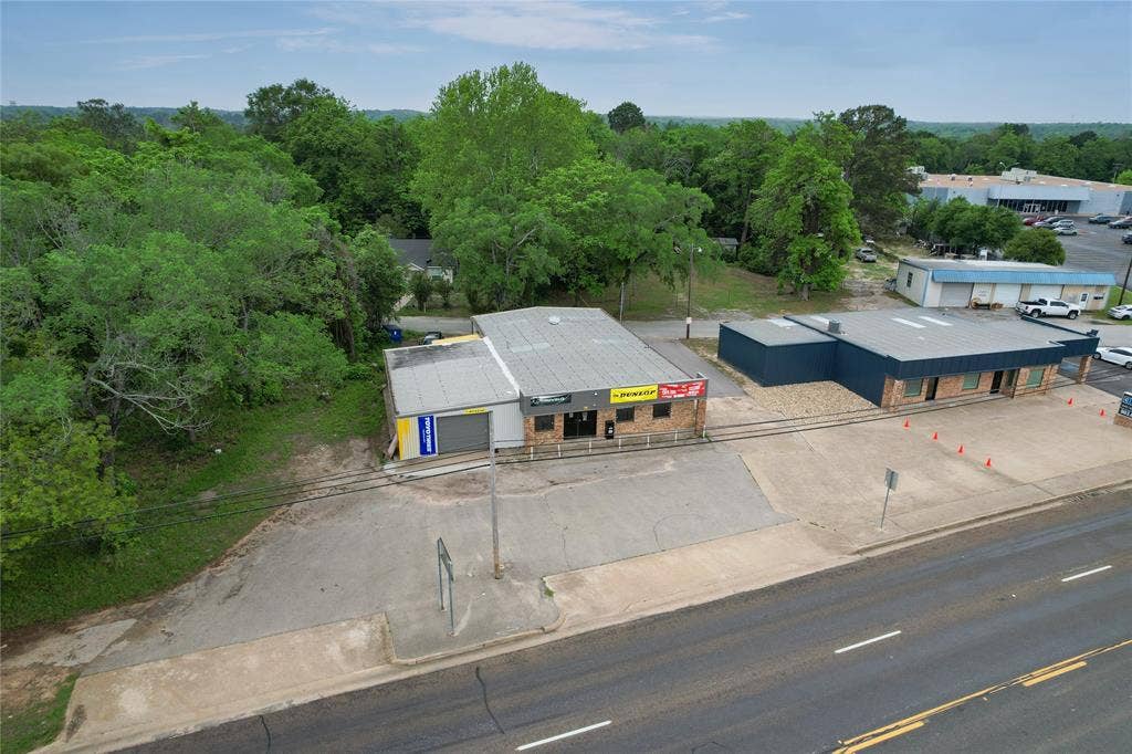 807 W Corsicana Street, Athens, TX 75751 Commercial property featuring two distinct structures with ample paved lot space