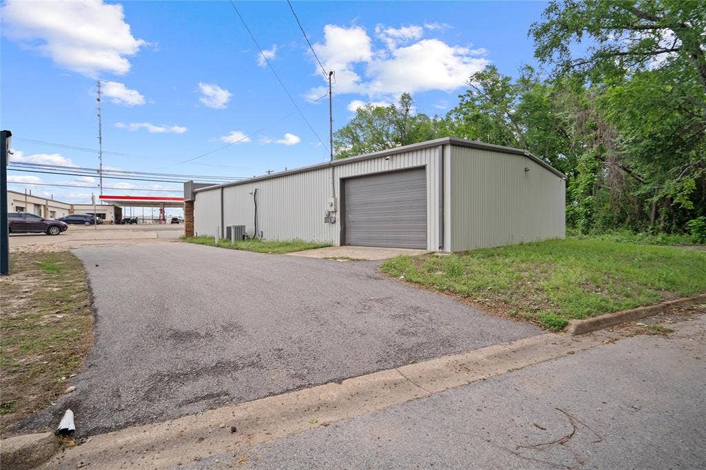 807 W Corsicana Street, Athens, TX 75751 Industrial-style building with corrugated metal siding