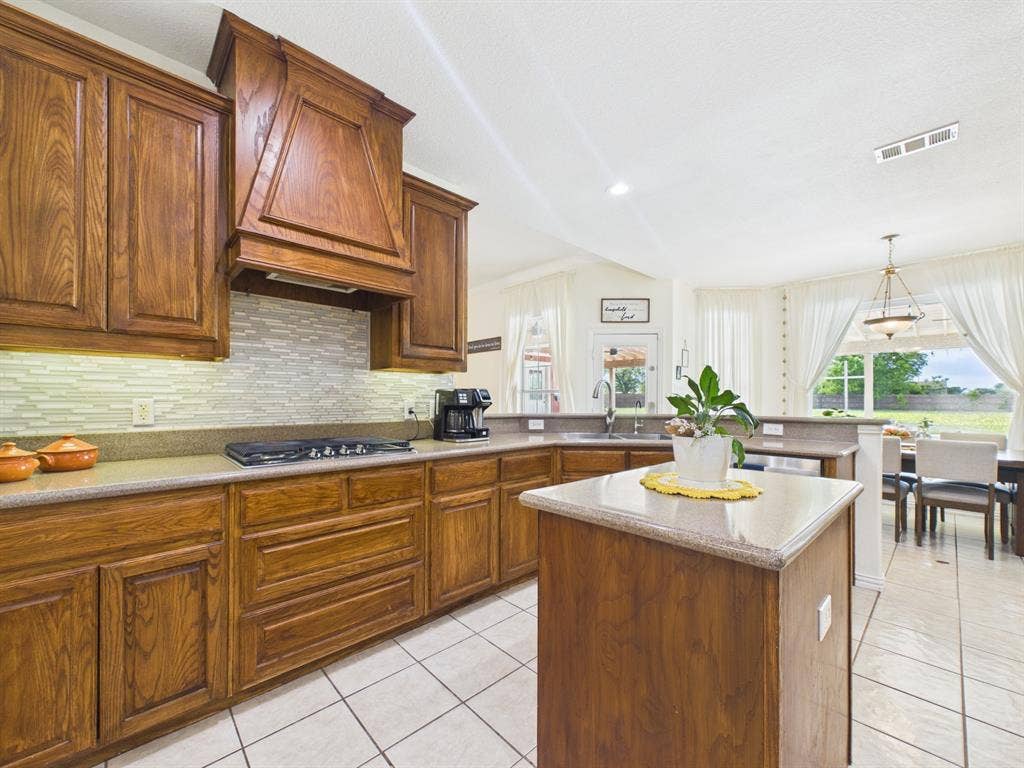 5640 Jennifer Lane, Midlothian, TX 76065 Tile floor & Corian countertops are neutral in color
