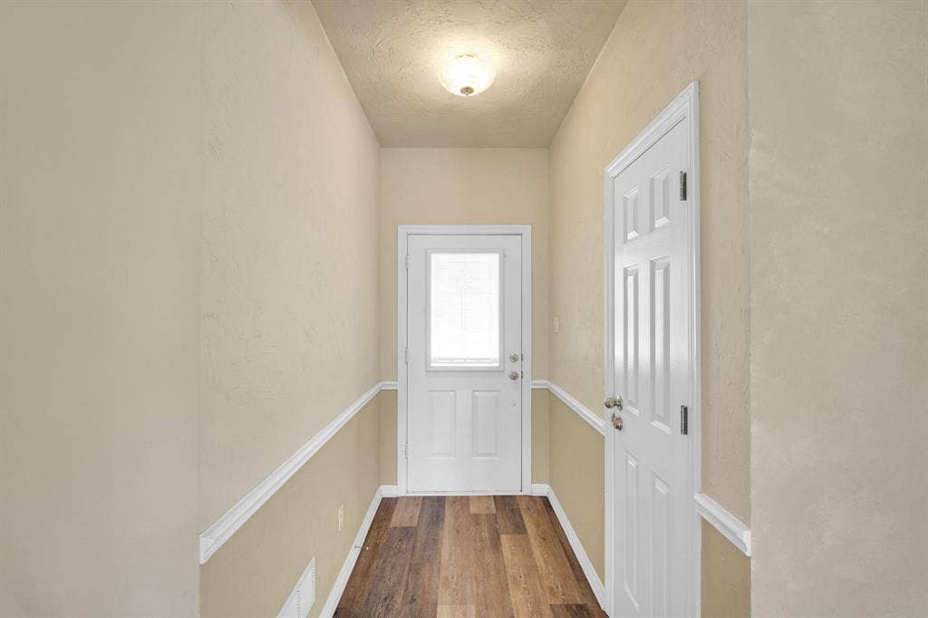 506 Whitney Drive, Midlothian, TX 76065 Entryway featuring wood-finish flooring and a neutral color palette