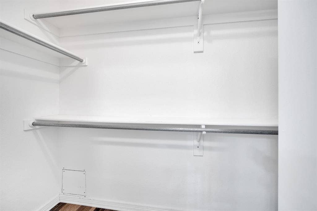 506 Whitney Drive, Midlothian, TX 76065 Built-in closet shelving and hanging rods provide organizational solutions within this space