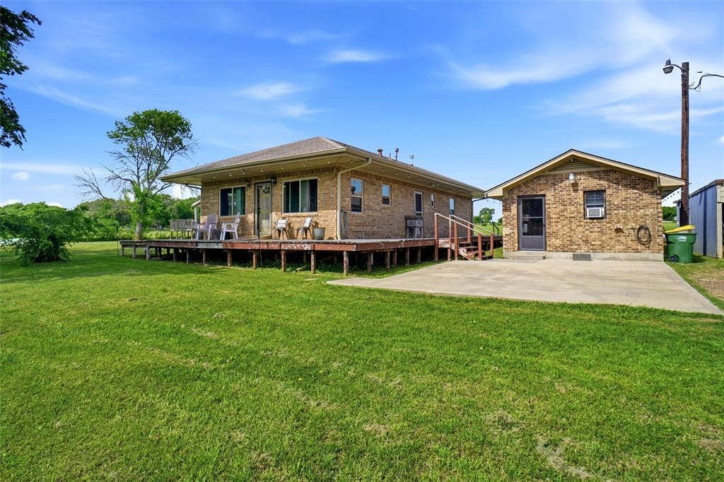 8983 W Odneal Road, Krum, TX 76249 Main house #1 and Mother-in-law house on the right hand side of the picture. Mother-in-law suite needs to be finished out. It is plumbed for a full bathroom and does not have central heating or air.