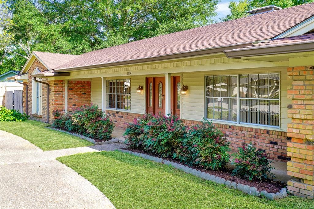 1114 Brookshire Drive, Tyler, TX 75071 Brick and siding exterior featuring a covered entry