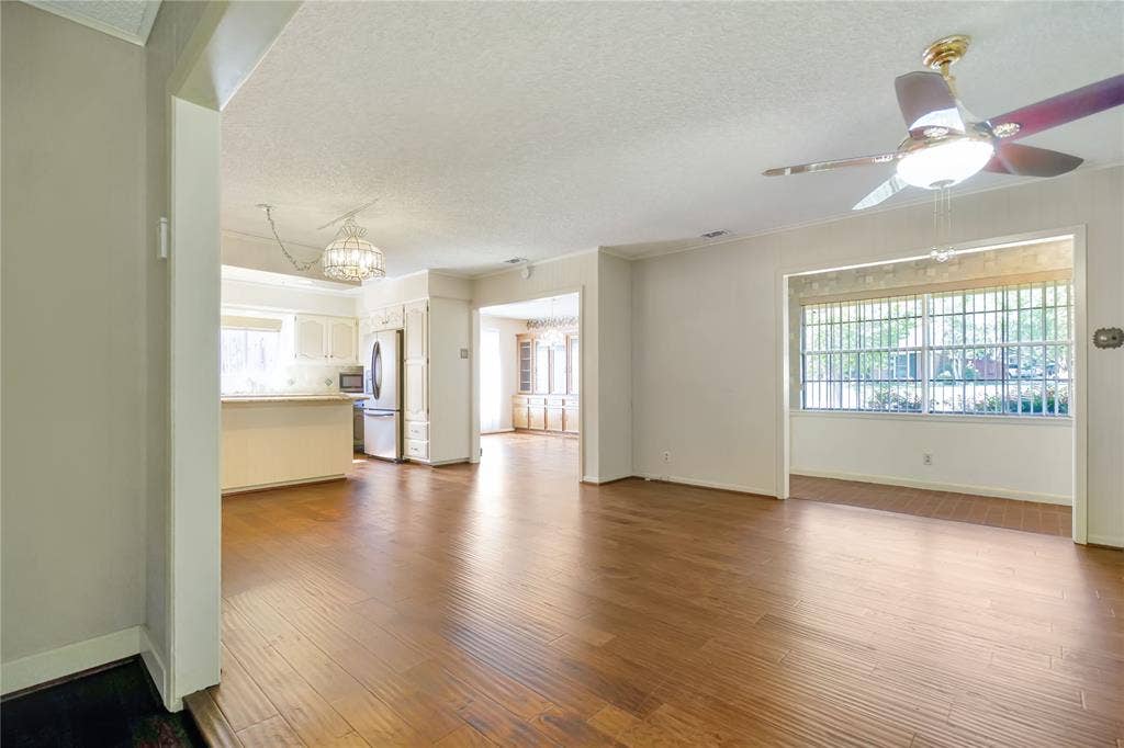 1114 Brookshire Drive, Tyler, TX 75071 Expansive interior showcasing warm wood-finish flooring throughout
