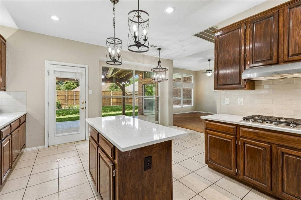 1105 Easton Lane, Allen, TX 75002 Find fantastic storage in the kitchen including 42 in cabinets, long counters for food prep, a pantry and easy access to the outside living space. Another feature is under and over cabinet lighting!
