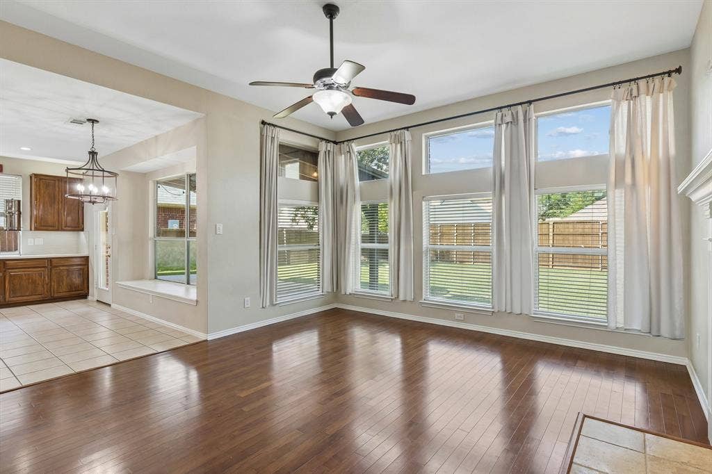 1105 Easton Lane, Allen, TX 75002 The family room is the heart of the home. Open to the nook and kitchen, this is a wonderful space for relaxing with family and friends or cozy nights in. Enjoy the wall of windows giving views of the back yard and lovely light!