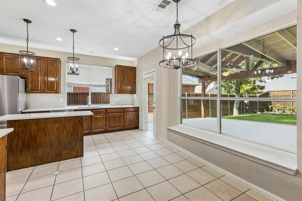 1105 Easton Lane, Allen, TX 75002 The nook overlooks the outdoor living space and beautiful backyard.