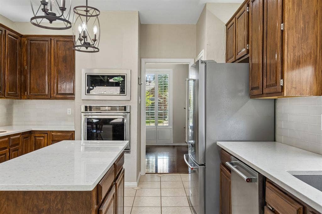 1105 Easton Lane, Allen, TX 75002 The kitchen has direct access to both dining areas - perfect for entertaining.